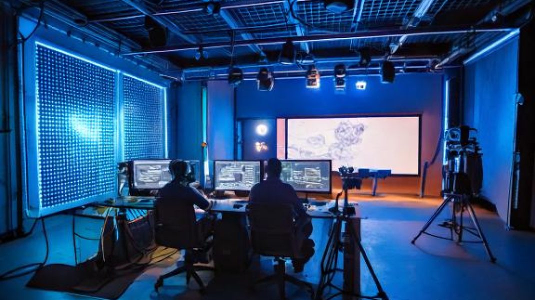 Firefly Interior shot of filming soundstage with LED walls, high tech cameras, and small workbays wi